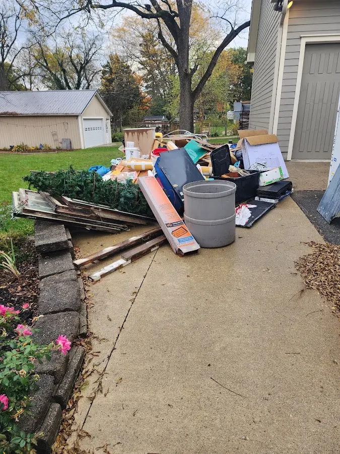 Dumpster being loaded with debris for 12 Yard Dumpster Rental in Castle Shannon